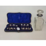 A set of ten silver teaspoons, with matching sugar tongs, and two other associated spoons, cased,