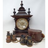 An early 20th century walnut mantle clock, two other clocks, four pairs of binoculars, and a