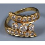 An 18ct gold and diamond crossover ring, ring size approx. M