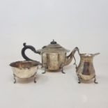 A silver three piece tea service, initialled, Birmingham 1911/12, 14.3 ozt (all in), spout
