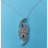 A 14ct white gold and diamond set pendant necklace