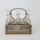 A silver plated cruet frame, with embossed and pierced decoration, 21.5 cm high Stand in good