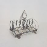 A Victorian silver six division toast rack, crested, London 1851, 9.3 ozt Base very uneven,