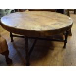 A 20th century oak and iron coffee table, 98 cm diameter