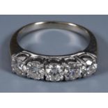 An 18ct gold and five stone diamond ring, ring size I½ Central diamond 3.9mm approx. deep, total
