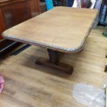 An oak dining table, on carved bulbous supports to scrolled feet, 180cm wide