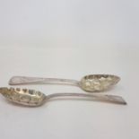 A pair of George III silver Old English pattern berry spoons, London 1806, later Victorian