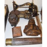 A 19th century sewing machine, a pottery caddy in the form of an owl, a 19th century telescope, a