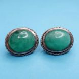 A pair of oval jade earrings