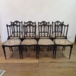 A set of eight Colonial ebony chairs, on turned tapering legs (8) Date - Late 20th century