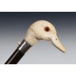 A 19th century automata walking stick, the carved ivory handle in the form of a duck with glass