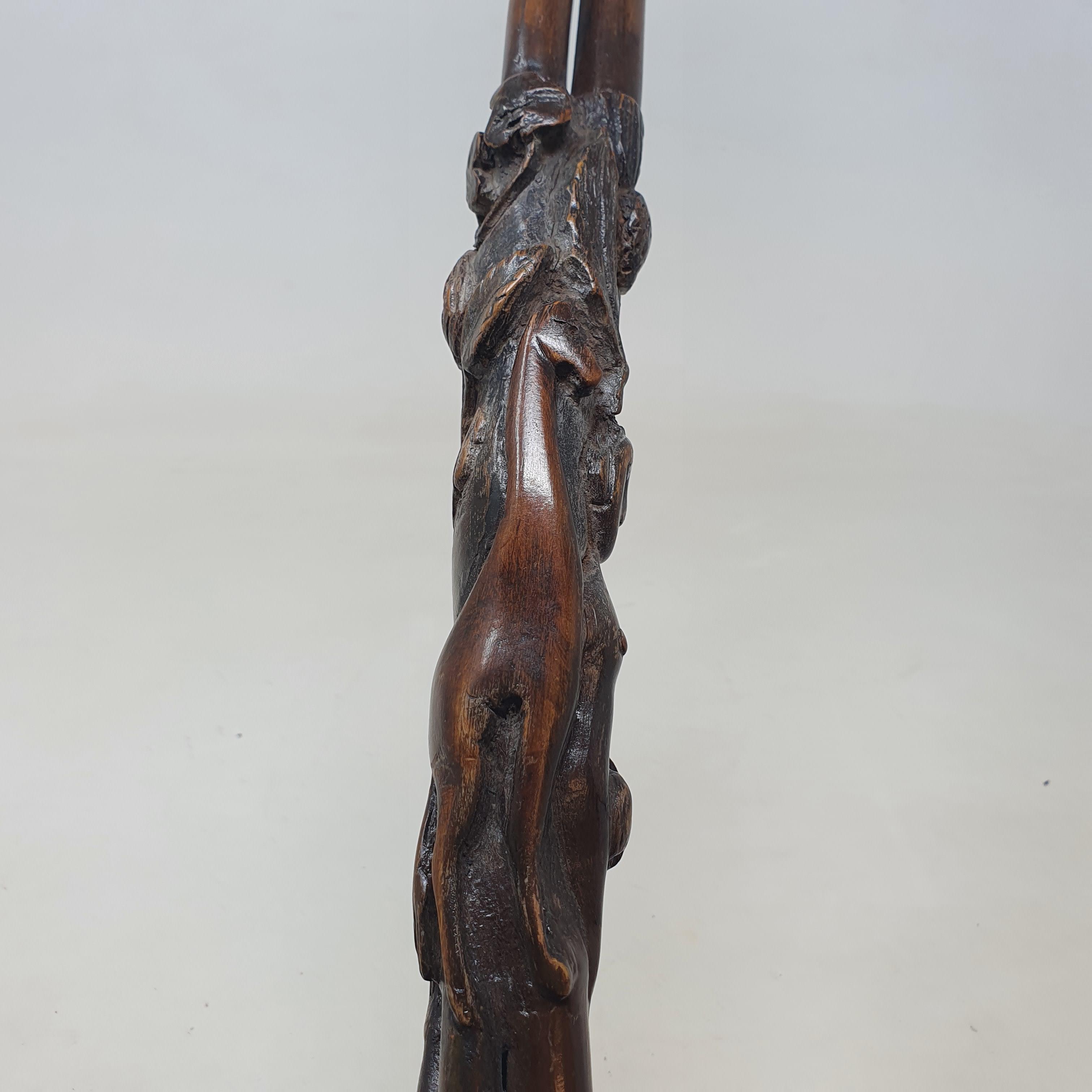 A 19th century folk art walking stick, the handle carved in the form of a talon gripping an egg, - Image 9 of 12