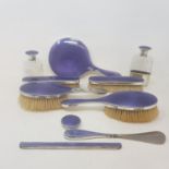 A silver and purple enamel part dressing table set, some damages, London 1917