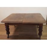 A 19th century mahogany extending dining table, on turned tapering reeded legs, 156 cm wide, lacking
