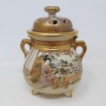 A Japanese Satsuma earthenware koro and cover, decorated figures, mark in gilt, cover restored, 23