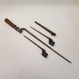 An early 20th century bayonet, 53 cm and two pig sticker bayonets, one with scabbard (3)