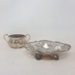 A late Victorian pierced silver sweet meat dish, London 1899, 18.5 cm wide, and a silver two handled