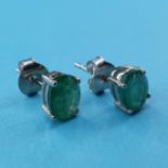 A pair of emerald stud earrings