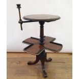 A 19th century amboyna, ebony and boxwood strung reading stand, with an adjustable candle holder, on