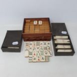 A Chinese mah-jong set, in a wooden box, box held together with sellotape and incomplete, 17 cm