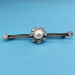An early 20th century pearl and diamond star brooch