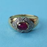 An 18ct gold, ruby and diamond ring, ring size N