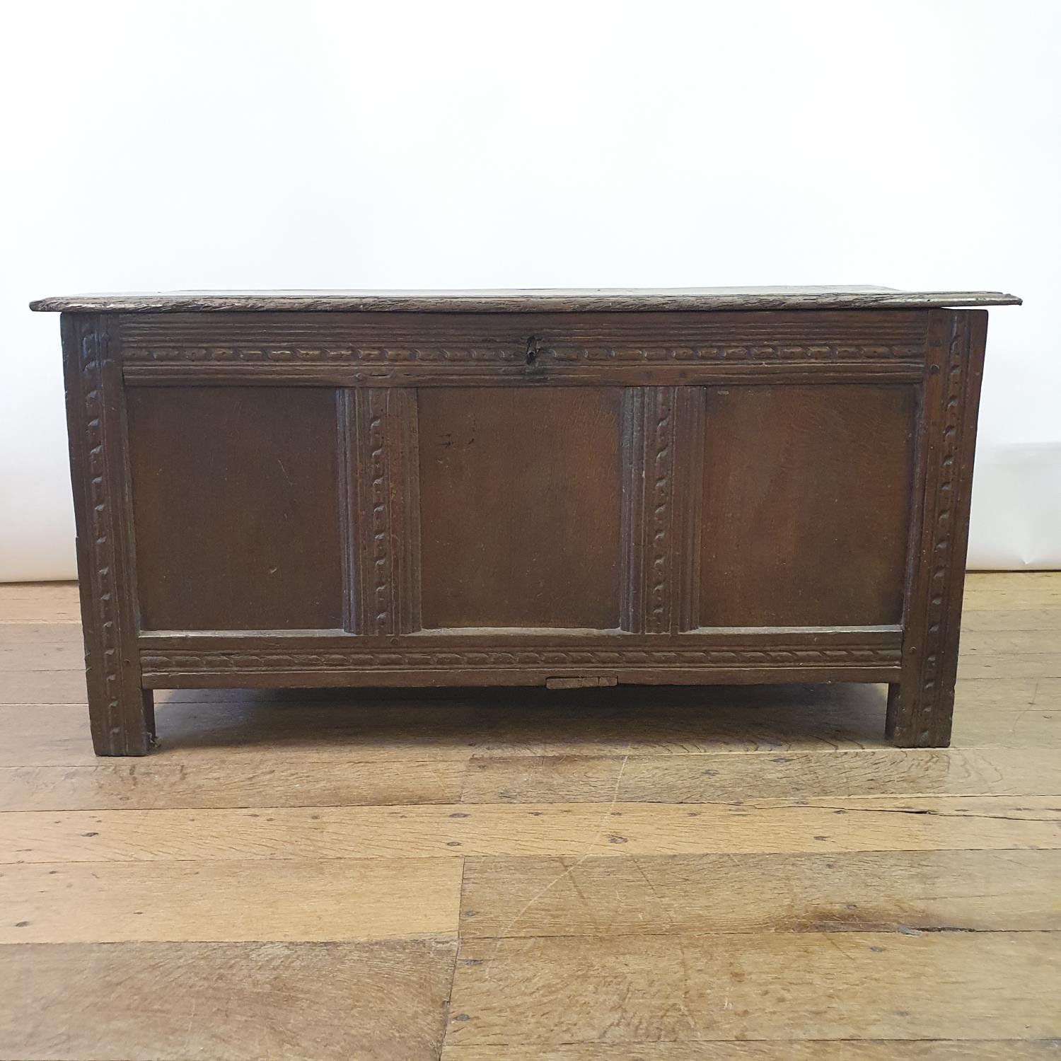 An 18th century oak coffer, 104 cm wide