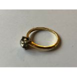 An 18ct gold and solitaire diamond ring, 3.3 g (all in)