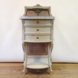 A 19th century French painted marble topped bedside table, having three drawers, on carved