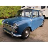 A 1968 Austin Mini 1000 Registration number VPB 795F Teal blue with an Old English white roof Low