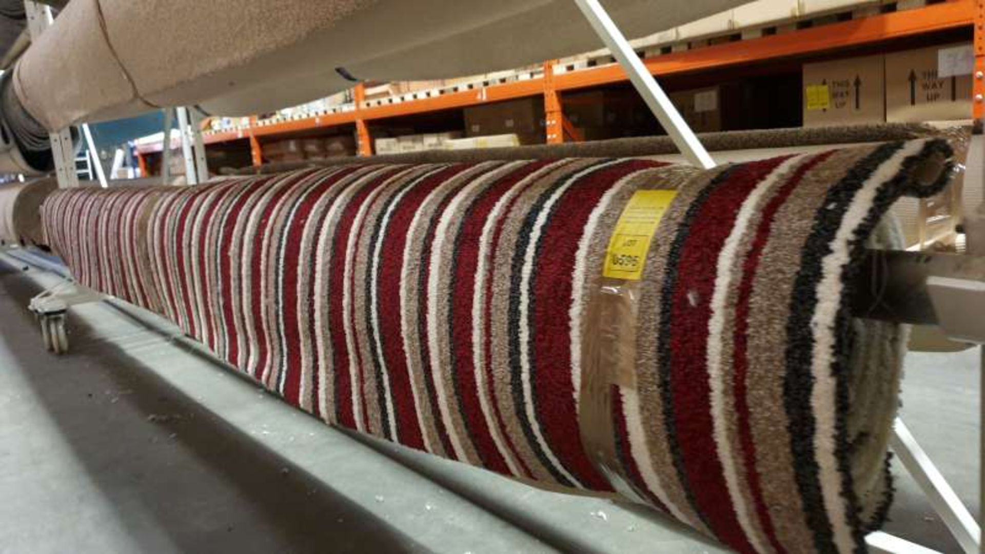 ROLL OF RED / BROWN / BLACK / WHITE STRIPED COLOURED CARPET APPROXIMATE SIZE