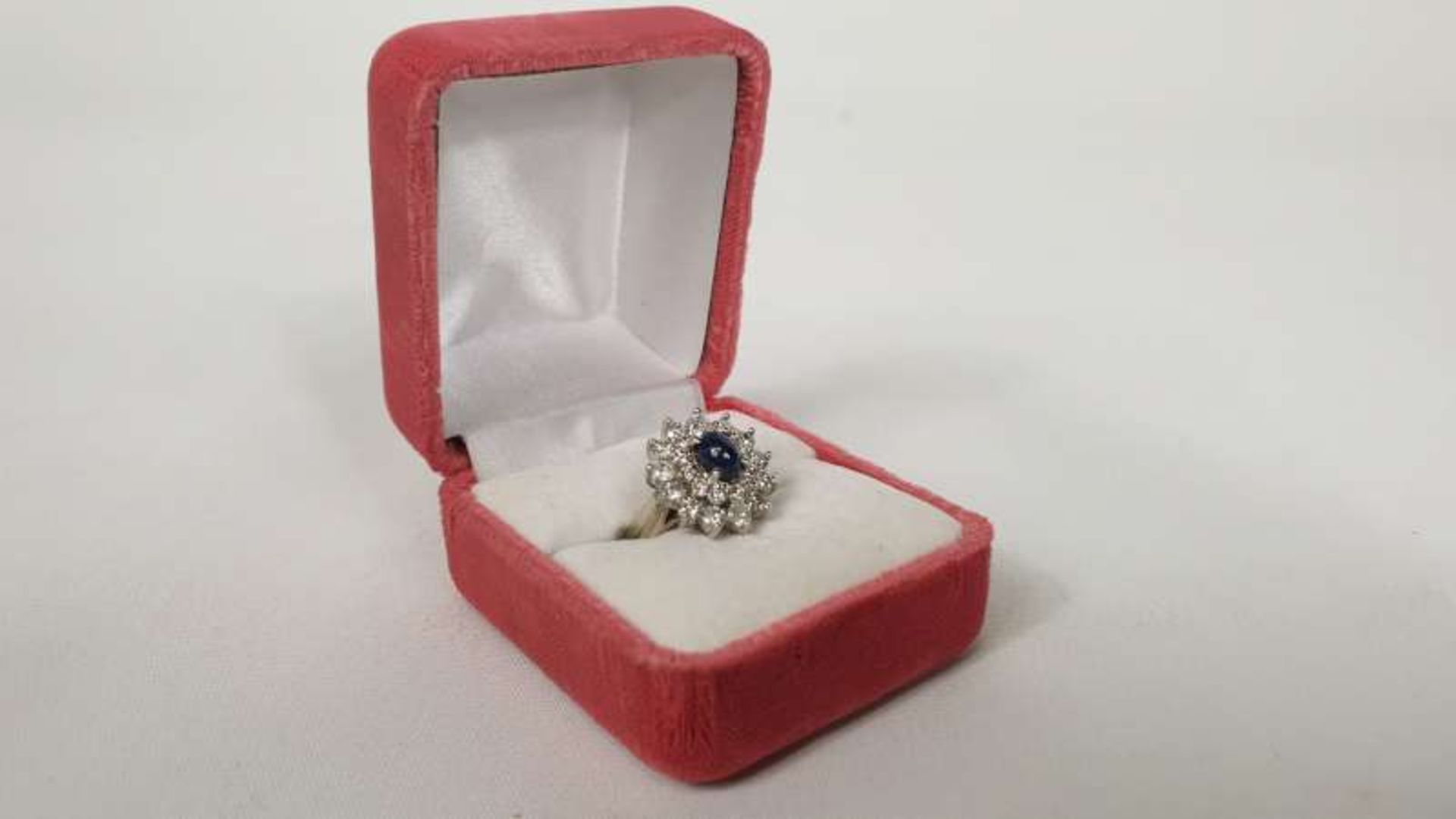 WHITE METAL STAMPED 14K CABOCHON SAPPHIRE AND TWO ROW DIAMOND CLUSTER RING, VALUATION FOR