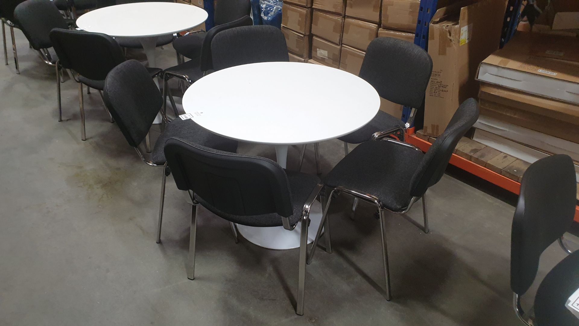 MEDIUM ROUND WHITE TABLE WITH 5 CHARCOAL GREY AND CHROME CHAIRS