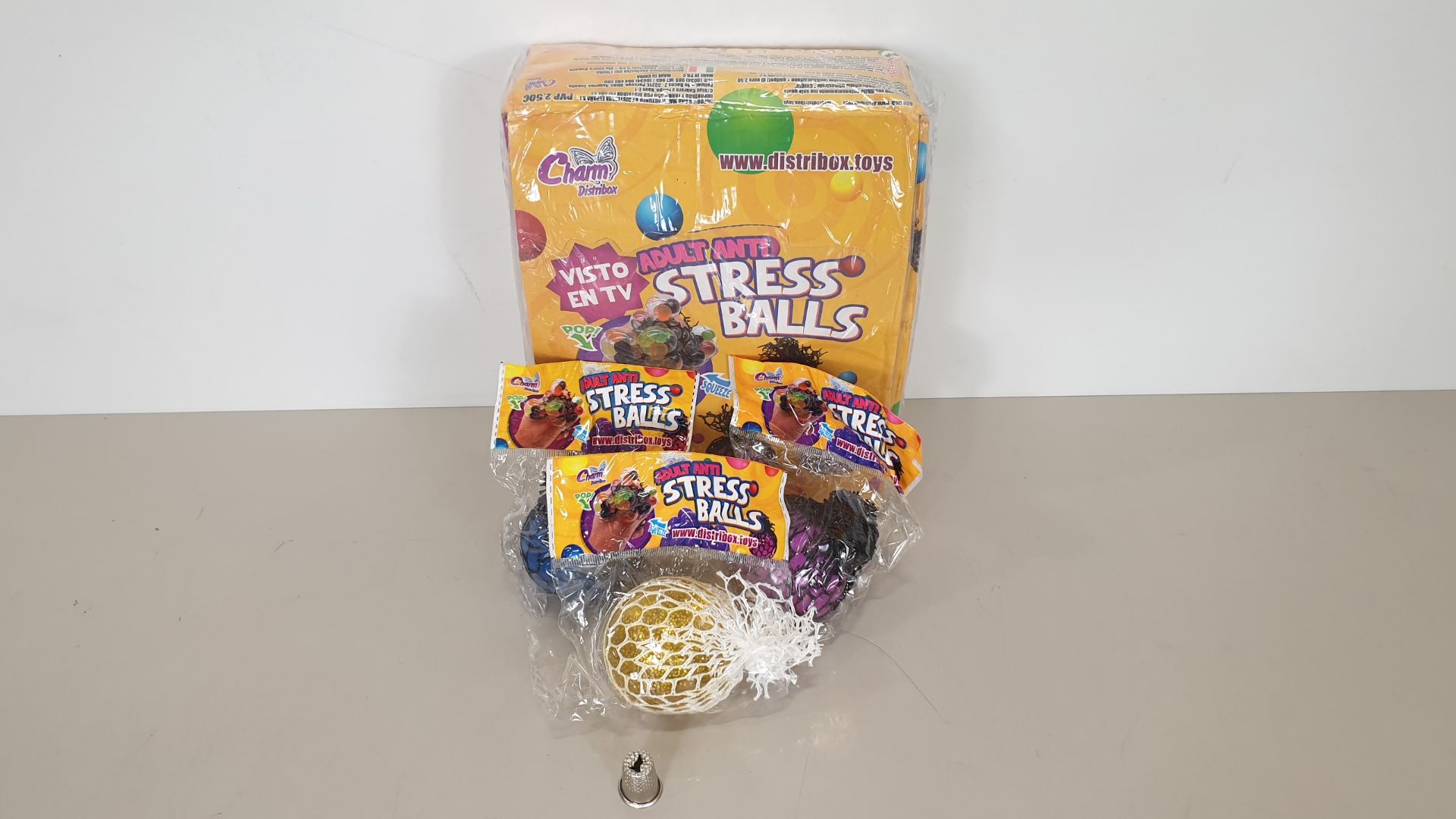 120 X ADULT STRESS BALLS IN 12 DISPLAY BOXES (10 ASSORTED COLOURS PER BOX)