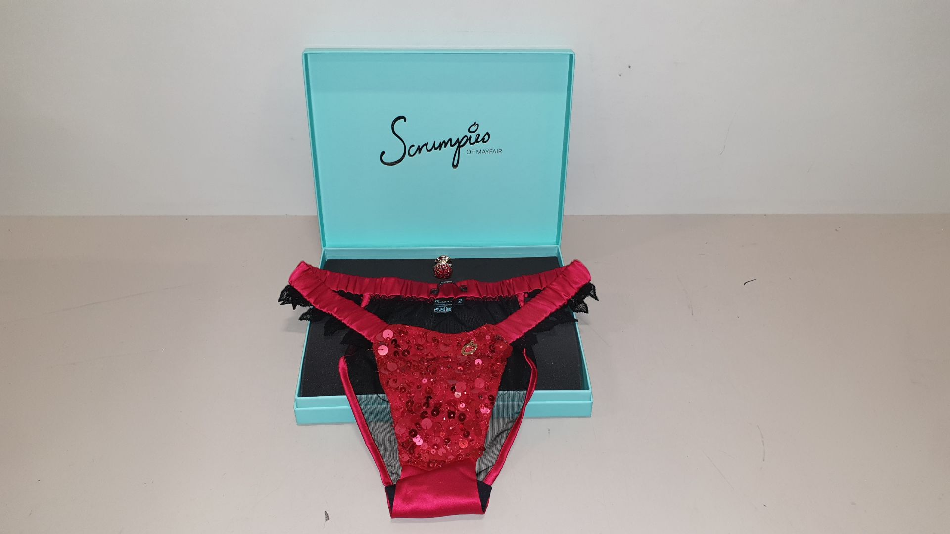 50 X SCRUMPIES OF MAYFAIR CHERRY COX TANGA BRIEFS - SIZES 8-16 (1-5) WITH BAG OF 50 CHARMS AND 25