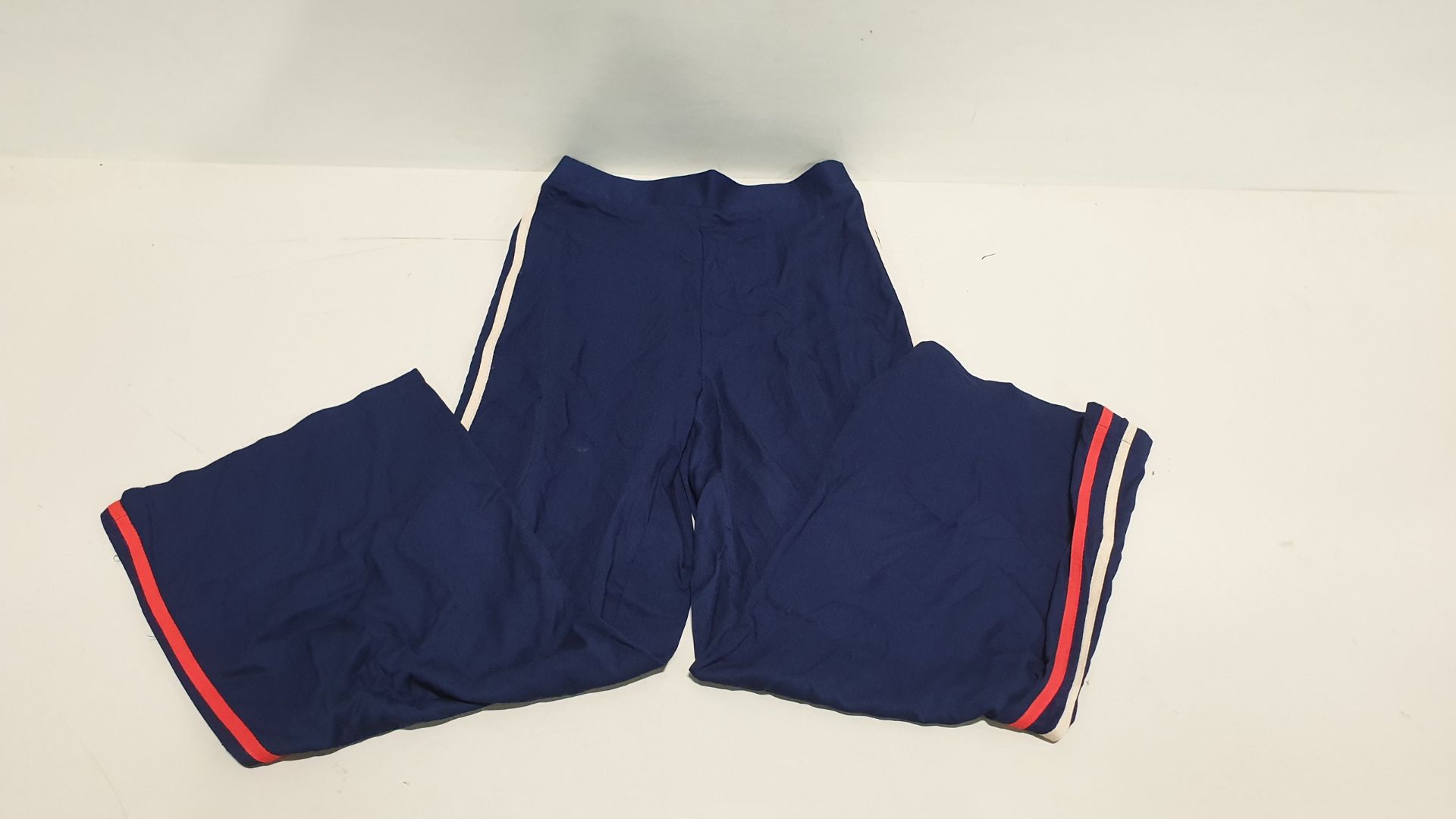 70 X BRAND NEW PAIRS OF DARK BLUE TROUSERS WITH RED STRIPE (AVON CODE F7376000) - SIZE 14-16 - IN