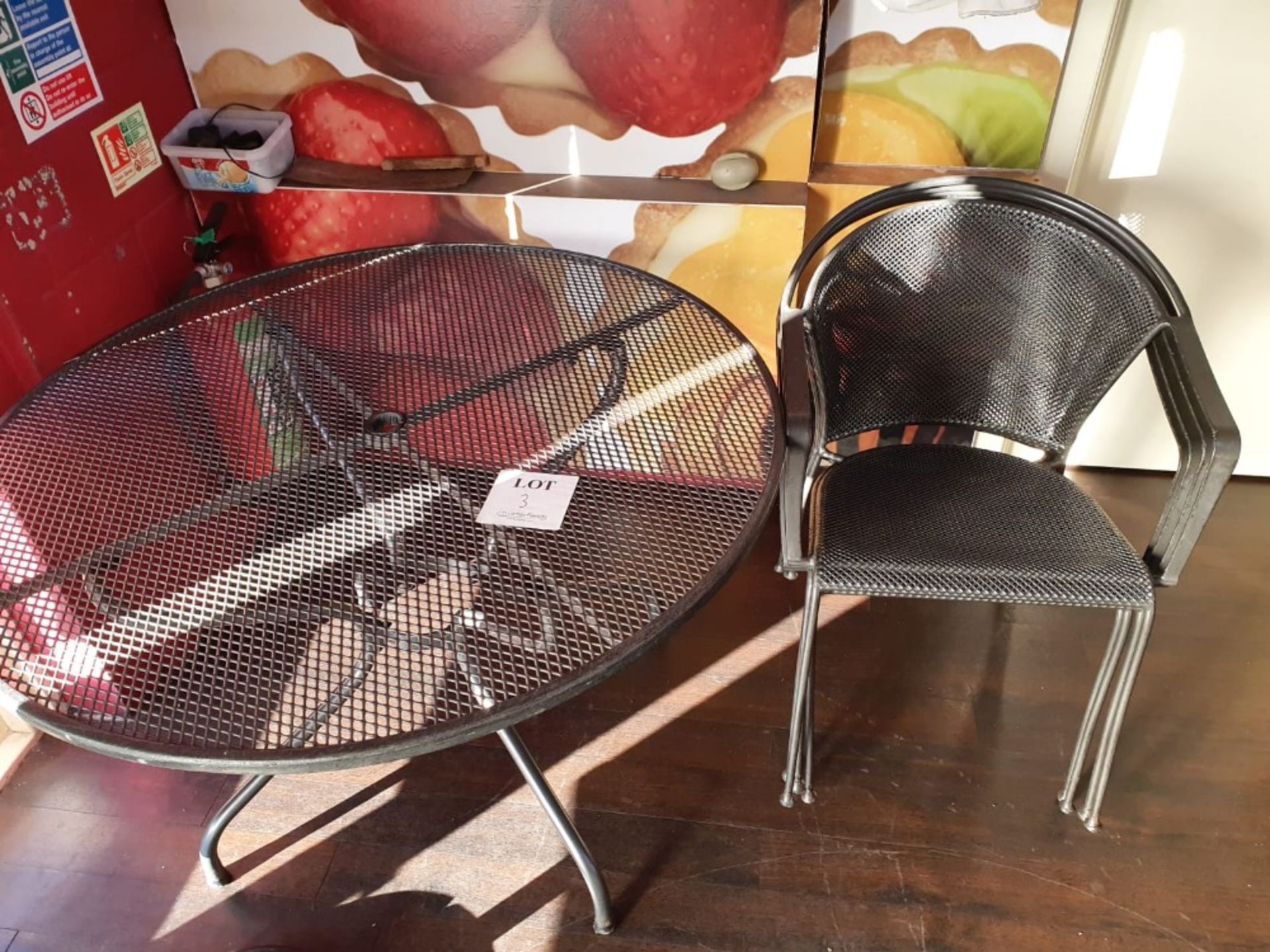 Metal circular table 1,050mm diameter with 4 metal chairs