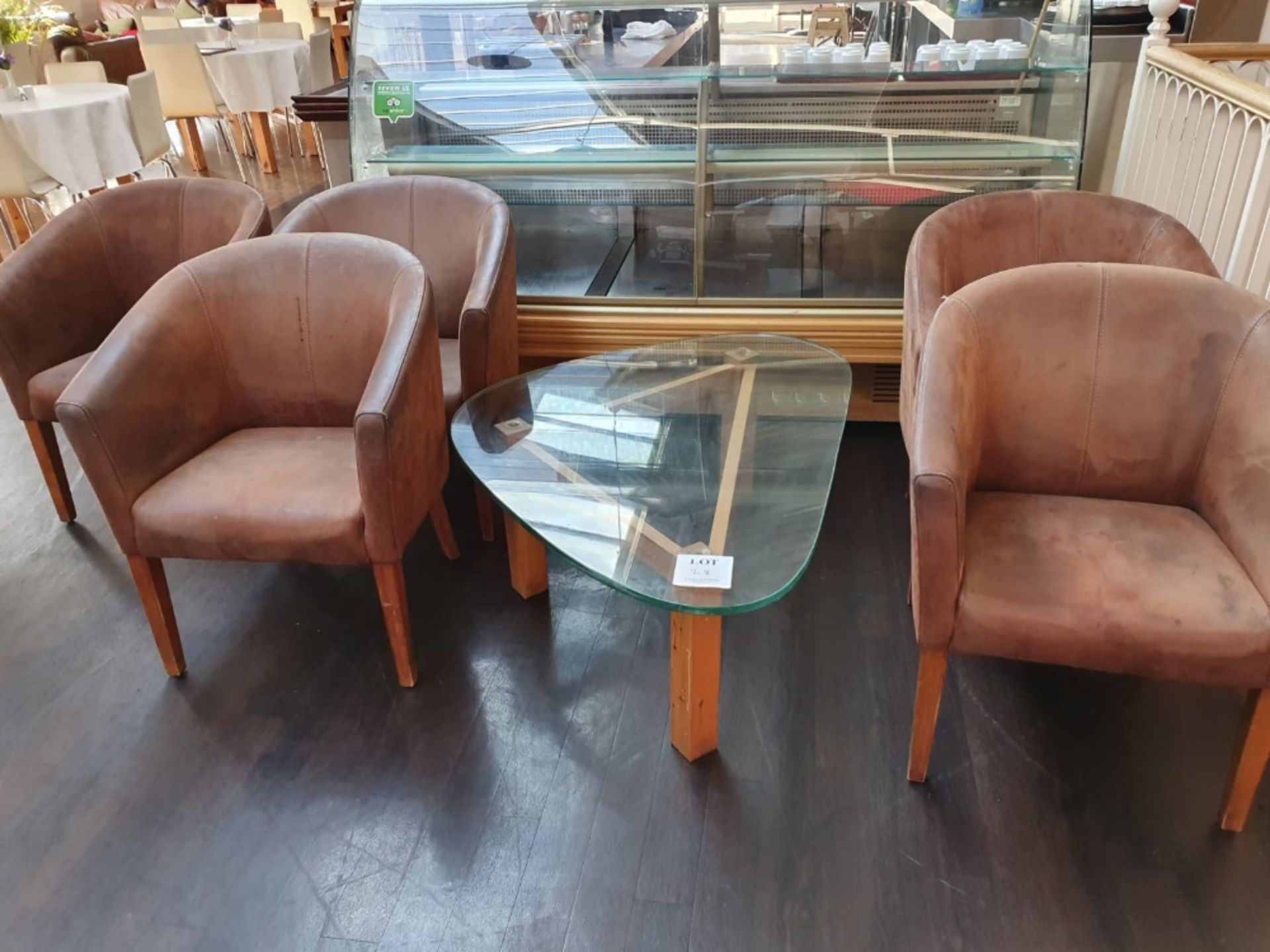 5 - leather tub chairs and wooden glass topped coffee table