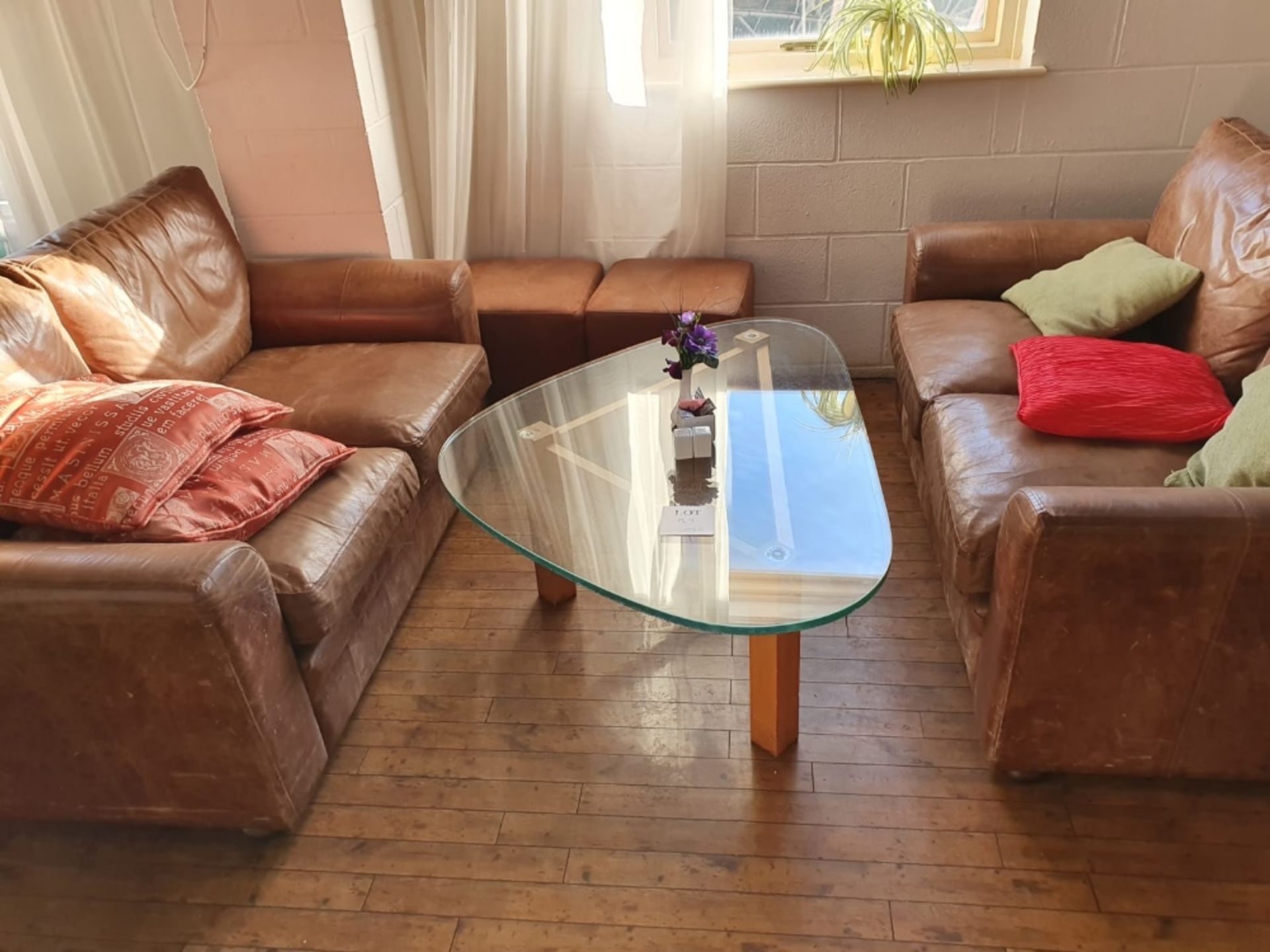 2 - leather 2 seater sofas and wooden framed glass topped coffee table and 2 leather footstools