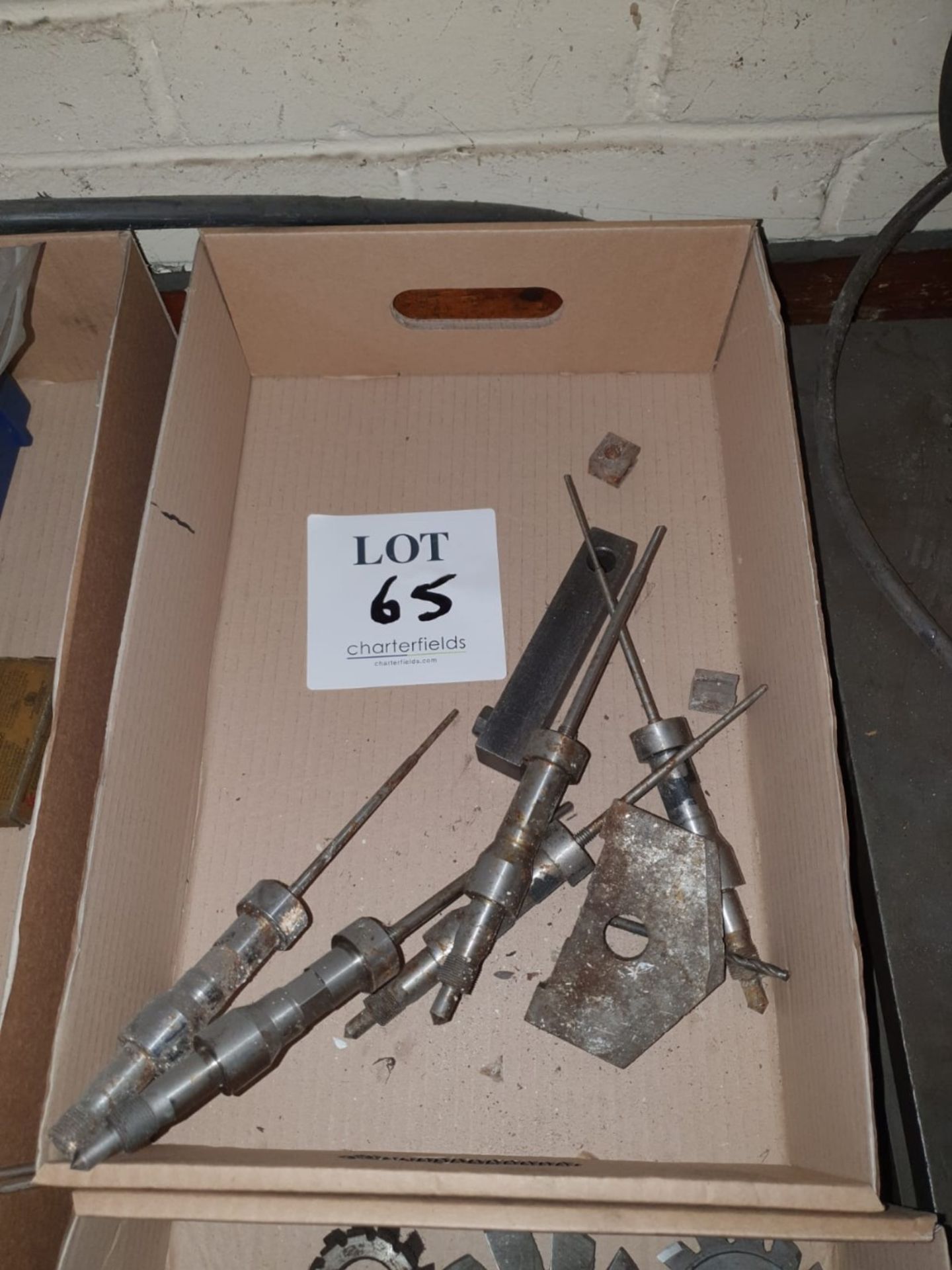 Box containing large tap wrench and 5 - needle arbours