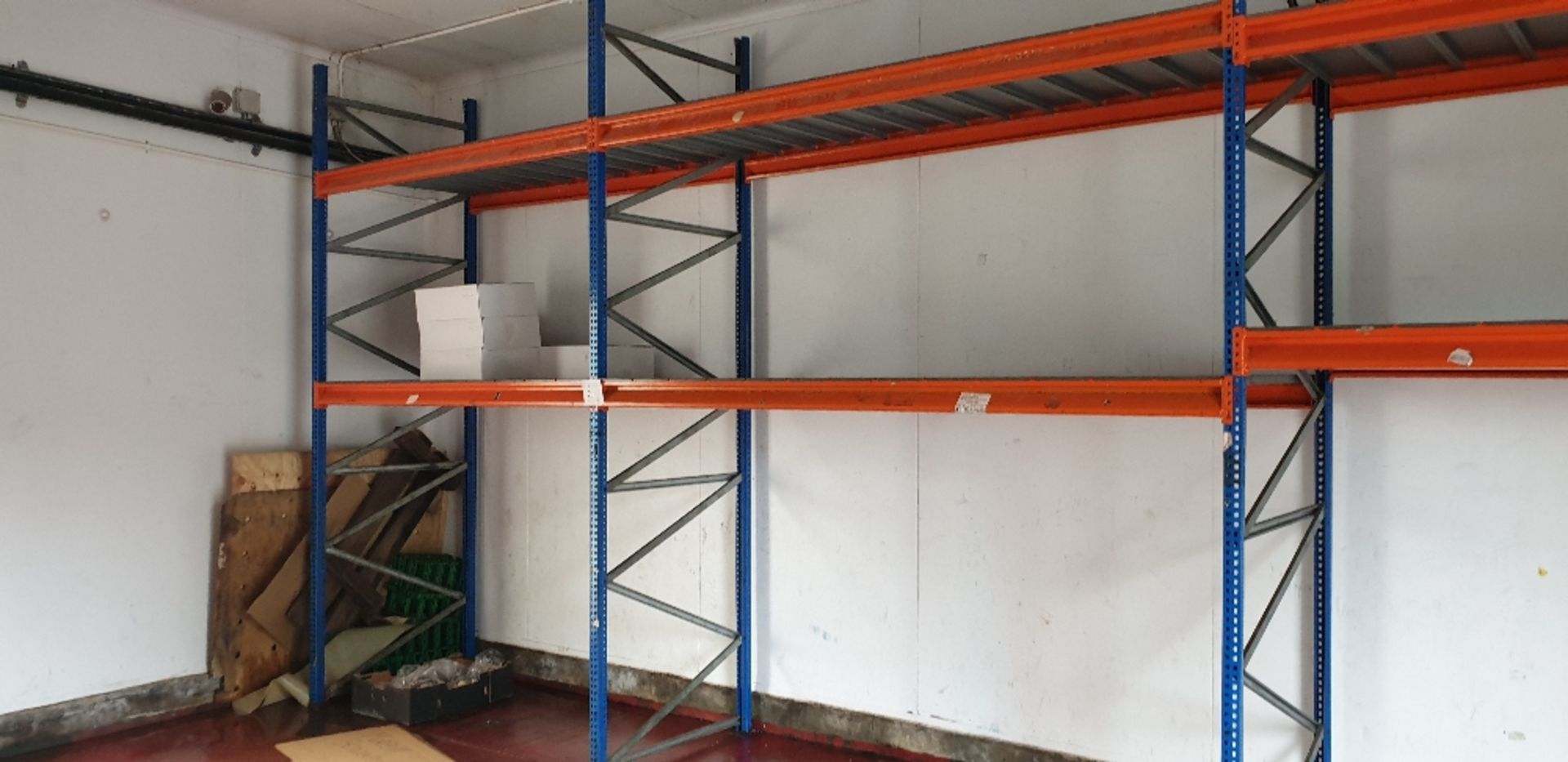 4 - Bays of pallet racking with steel panel shelving