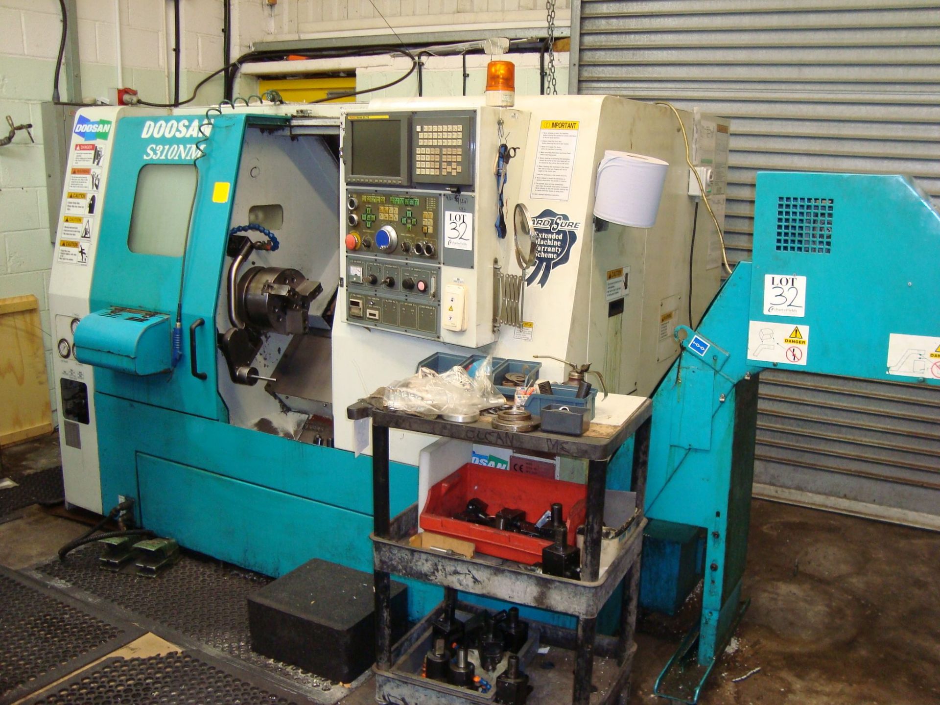 A Doosan S310NM CNC turning centre Serial number LSC1005 with Fanuc Series 21i-TB control, swarf - Image 2 of 7
