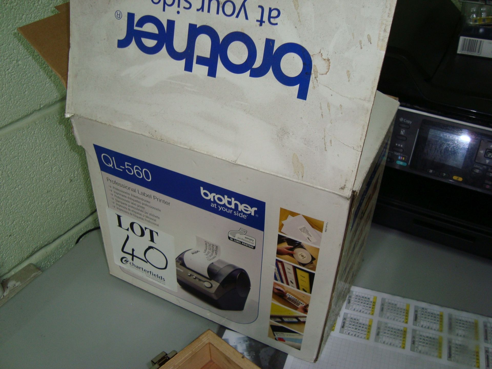 A Brother QL-560 label printer (boxed)