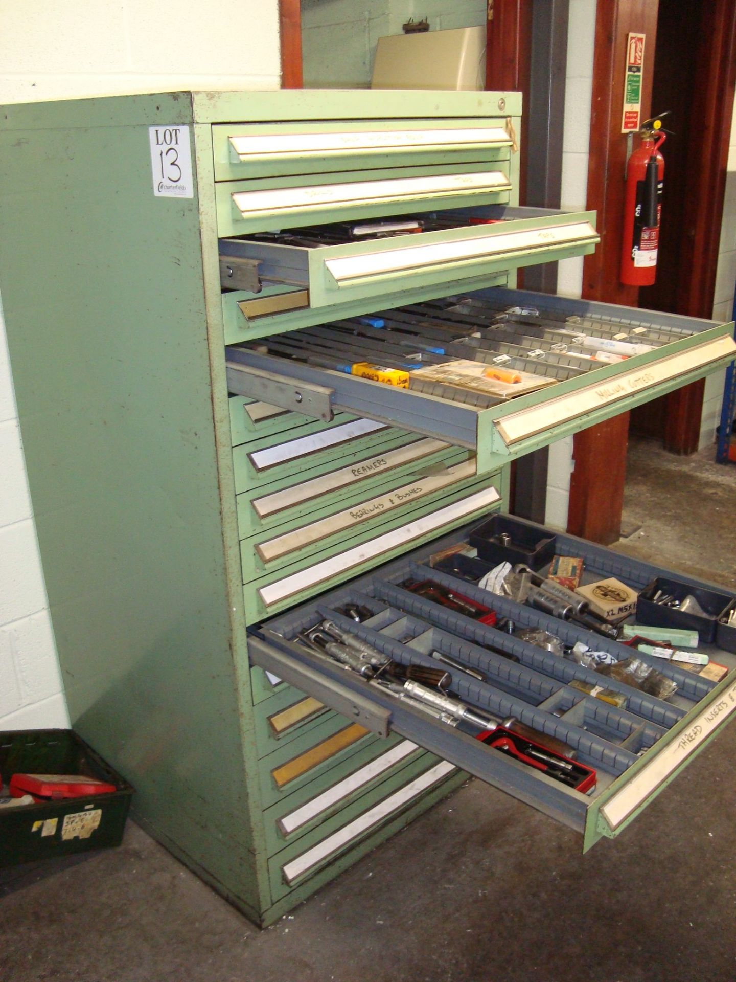 A steel lockable 16 drawer tool chest with a quantity of drilling, reaming and tapping tools, as