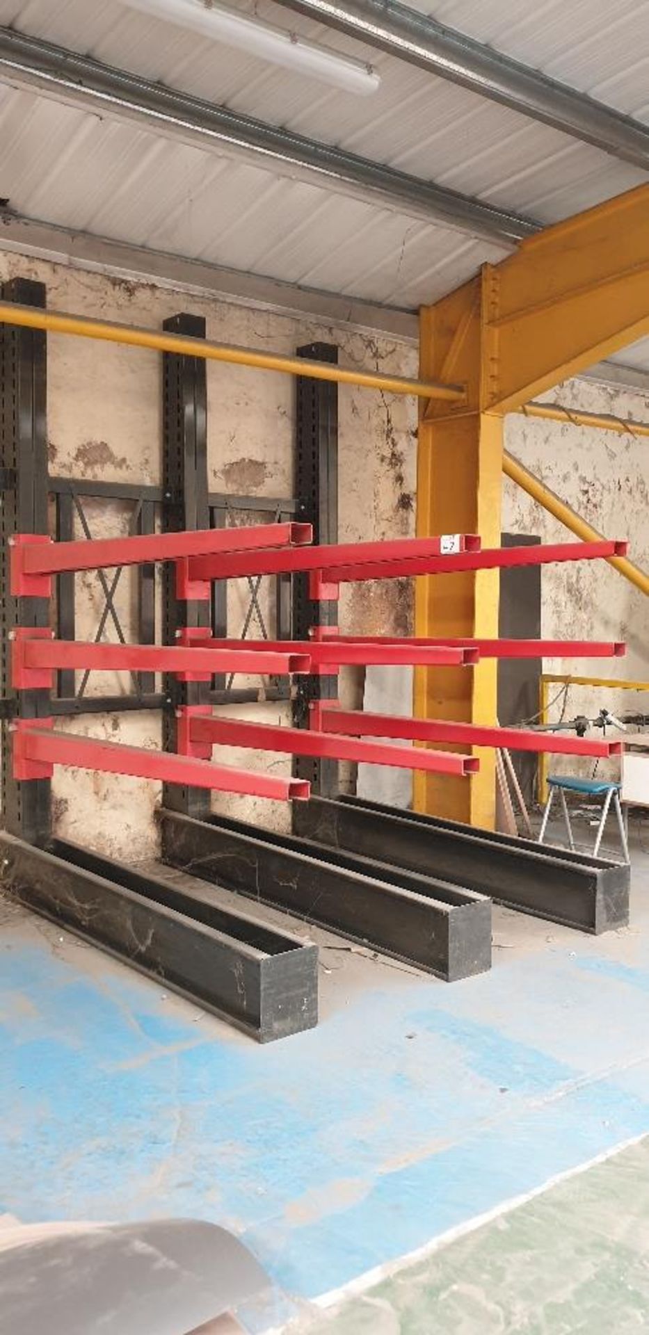 Heavy duty cantilever sheet rack comprising of three cantilever frames and 9 beams