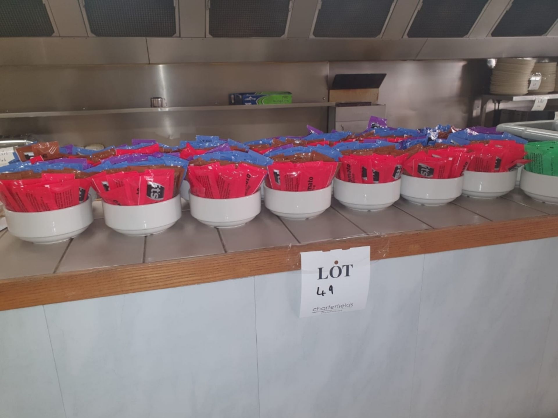 Large quantity of sauce sachets and pots