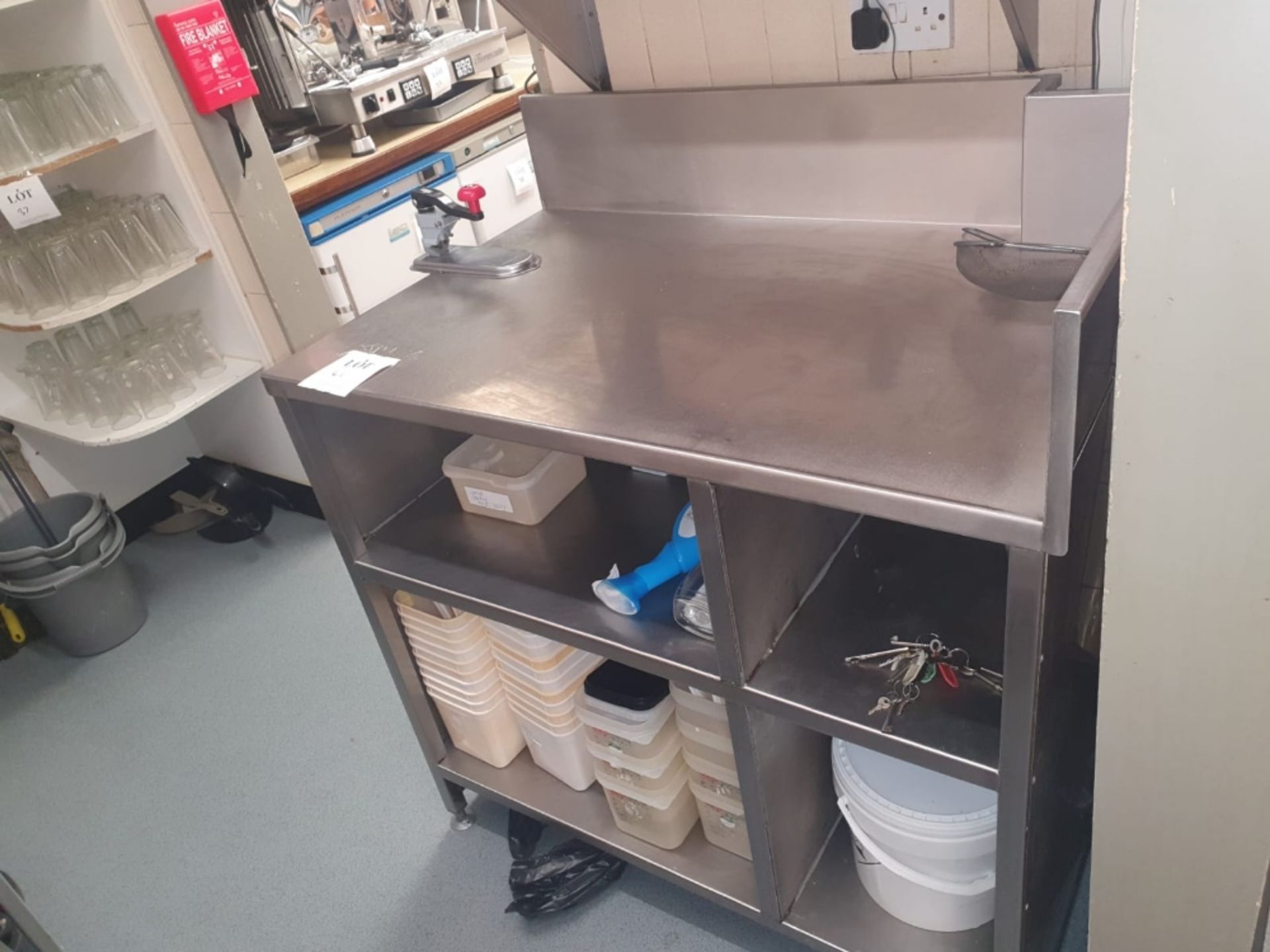 Stainless steel preparation unit with can opener and storage facility