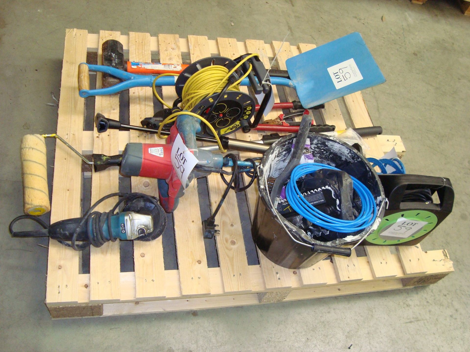 A quantity of general hand and power construction tools, together with two wheelbarrows, as lotted