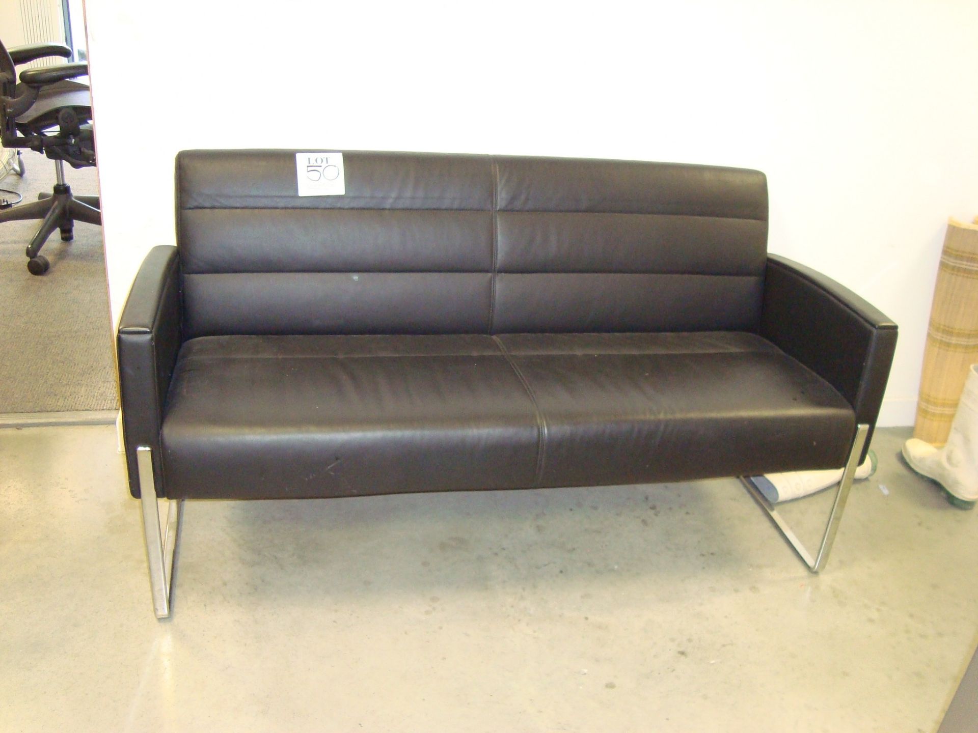 A leather effect multi seat sofa