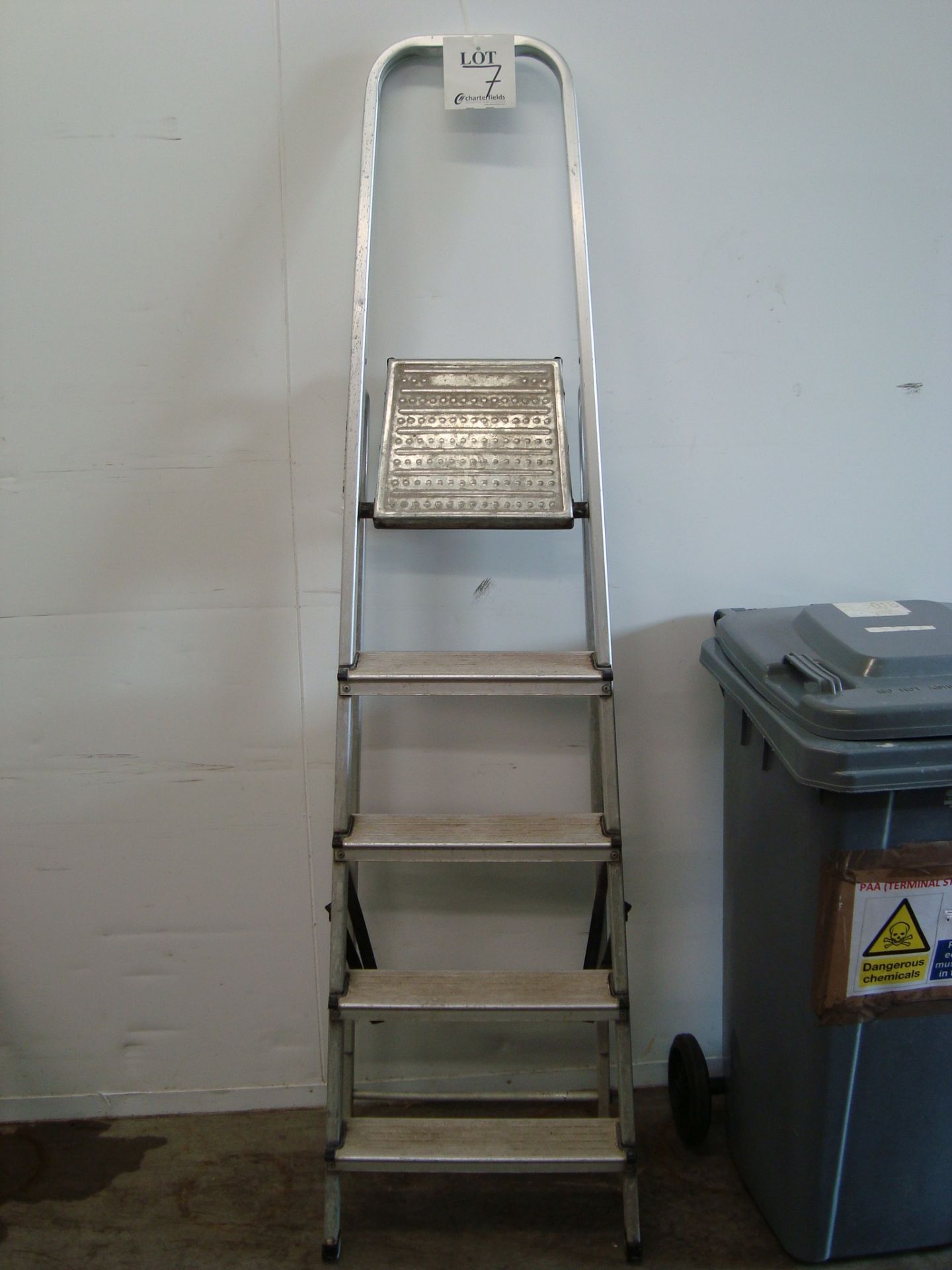 A Taskmaster mobile aluminium seven tread step ladder and two folding aluminium step ladders